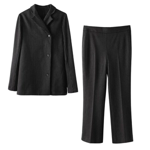 Detail of classic black pinstripe suit set with notch lapel blazer and trousers