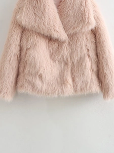 Detailed close-up of pink faux fur coat showing soft plush texture and wide collar