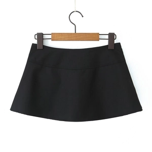 Flat lay detail of a black high-waisted A-line mini skirt with textured woven fabric