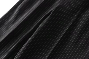 Detailed close-up of high-quality black pinstripe woven fabric with fine texture and drape