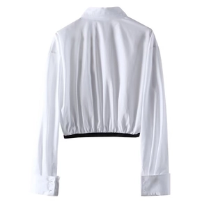 Back view of a cropped white long-sleeve shirt with an elastic black waistband detail