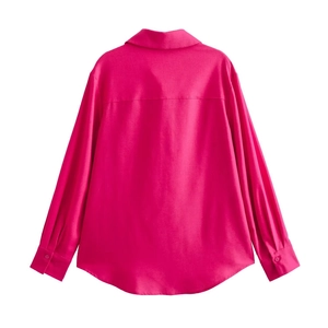 Detail view of rose red long sleeve shirt back with horizontal seam and curved hemline