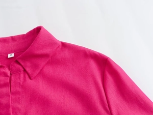 Close-up of pink long sleeve shirt collar showing fabric texture and size S label