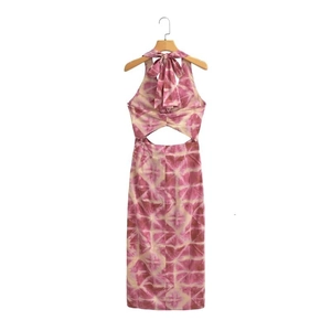 Detail of halter neck tie with large bow and back cutout on tie-dye midi dress