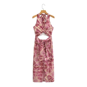 Detail of bohemian tie-dye halter dress featuring waist cut-out and knot design