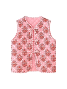 Detail of pink quilted cotton vest with floral print and striped ribbon tie closures