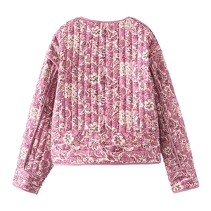 Rear view of pink floral quilted jacket featuring vertical stitching and piping detail