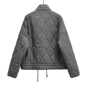 Back view of dark grey quilted jacket with stand collar and adjustable drawstring hem