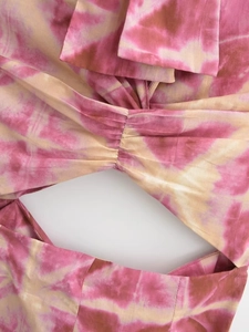 Detailed view of the tie-dye pattern with a stylish front knot and center cutout design