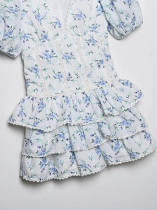 White V-neck floral mini dress with lace patchwork and tiered ruffle cake skirt