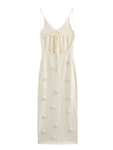 Chic cream-white knit maxi dress featuring backless tie design and 3D floral textures