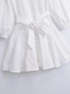 White French eyelet lace mini dress with V-neck, button details and waist tie belt