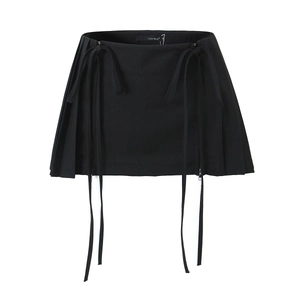 Detail view of high waist pleated skirt with side ribbons and invisible zipper closure