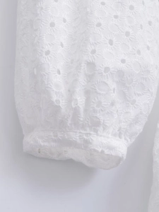French white V-neck mini dress with eyelet embroidery and cuffed long sleeves details