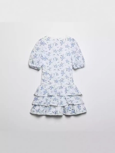 Sweet white V-neck floral tiered dress with blue print and lace trim for women