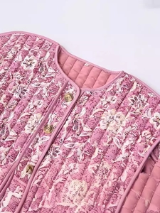 Floral print quilted cotton jacket for women featuring a round neck and button closure