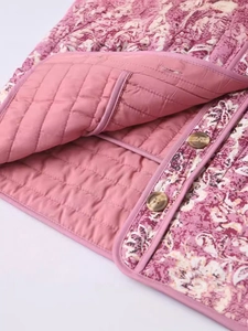 Quilted floral jacket for women featuring pink flower patterns and amber texture buttons