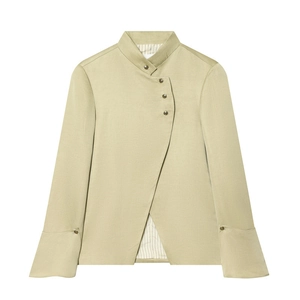 Detail of light green short coat with stand collar, asymmetric buttons, and bell sleeves