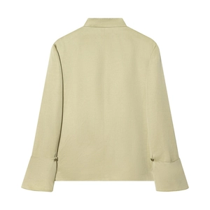 Detail showing back view of light green cotton blazer with fold-over cuffs and buttons