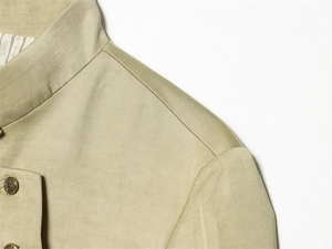 Detail of stand collar and antique bronze buttons on men's woven linen style jacket