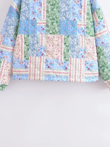 Close-up of floral patchwork quilted jacket showing diamond stitching and fabric detail