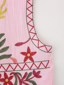 Close-up of pink Y2K vest featuring intricate floral embroidery and crepe fabric texture