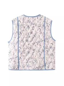Back view of a white quilted vest with blue and purple floral prints and light blue piping