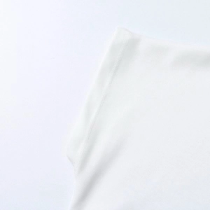 Detailed close-up of white knitted t-shirt shoulder seam and fine stitching quality