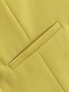 Macro detail of high-quality twill fabric and flat single welt pocket on a yellow vest