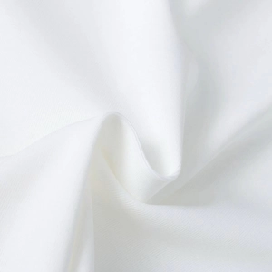 Close-up of white fabric texture showing detailed knit pattern and smooth material