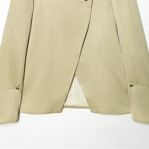 Back view of light green linen blazer with layered hem and vintage metal buttons
