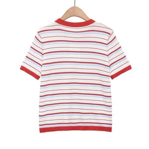 Detailed close-up of red rib-knit edges on a retro rainbow striped short sleeve t-shirt