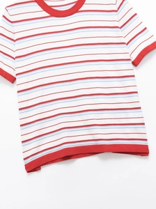 Detail of knit t-shirt fabric showing red and blue stripes with ribbed collar and cuffs