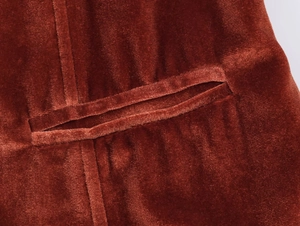 Close-up of velvet blazer double-welt pocket with detailed vertical ribbed texture