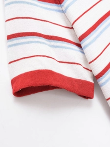Macro view of retro rainbow striped knit t-shirt fabric with ribbed cuff detail