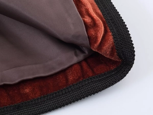 Macro view of velvet blazer lining with polyester fabric and reinforced mesh edging