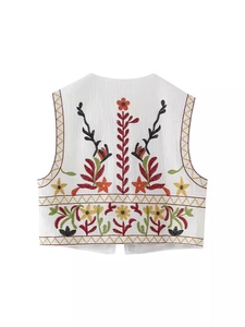 White embroidered Y2K short vest with colorful floral patterns and cotton texture