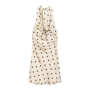 Detail of champagne polka dot satin dress with halter neck and side ruching detail