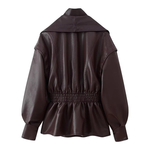 Detail of faux leather jacket featuring elastic ruched waist and elegant bubble sleeves