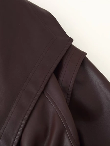 Close-up of deep purple leather jacket showing fine double stitching and lychee texture