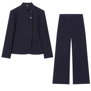 Detail view of navy blue pinstripe blazer with stand collar and high-waist wide-leg pants
