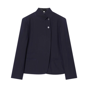 Detail of pinstripe navy blazer with asymmetric placket and stand collar design