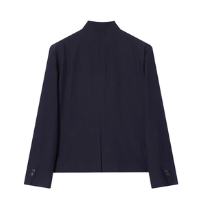 Detail of navy pinstripe blazer back with center vent and cuff buttons