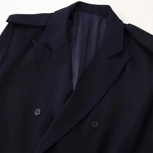Navy blue double-breasted coat with textured twill fabric and epaulettes on shoulders