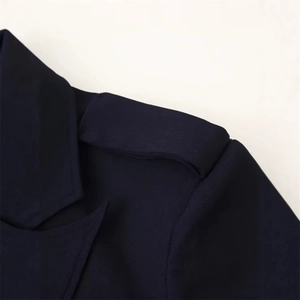 Navy blue women's blazer featuring classic lapels and shoulder epaulette detail