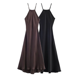 Detail of silk satin halter neck dresses in brown and black with smooth glossy finish