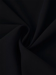 Detailed view of the black sequined shirt fabric showing premium woven texture and soft drape