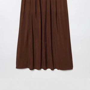 Brown midi dress with pleated satin fabric and a shimmering finish in a minimalist style