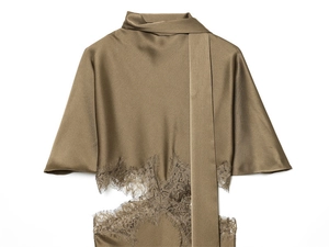 Detailed macro shot of coffee brown satin blouse featuring scarf tie neck and lace trim