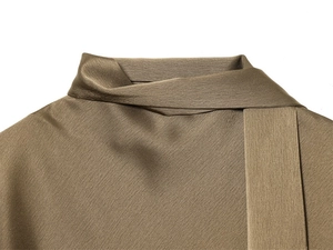 Detail shot of the satin collar and tie-neck design on this olive green silk dress